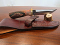 Buschcraft Messer, Feilenstahl, Walnuss Griff mit Wolf gravur, inkl. Lederetui.